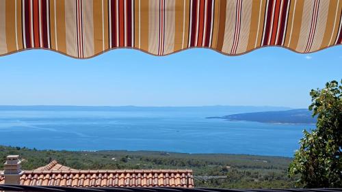 a view of the ocean from the top of a building at Holiday House Terezija in Baška Voda