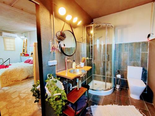 a bathroom with a shower and a sink and a toilet at Romantic Nest lloret in Lloret de Mar