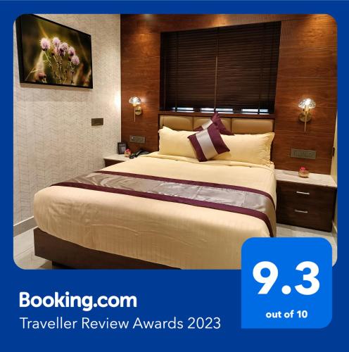 a hotel room with a large bed in a room at Retrieve Health & Wellness in Cochin