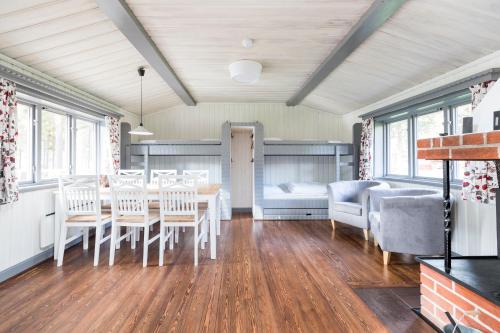 a dining room with a table and chairs at First Camp Orsa - Dalarna in Orsa