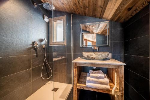 a bathroom with a sink and a shower at Chalet Floquet de Neu Les Gets- BY EMERALD STAY in Les Gets