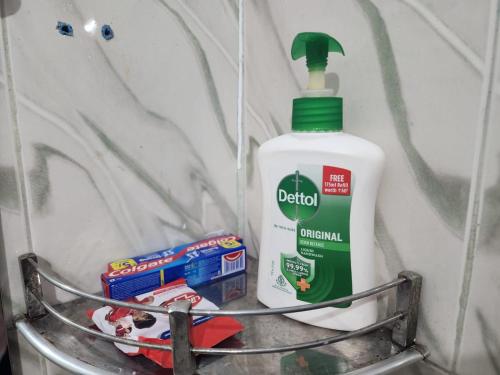 a bottle of bathroom cleaner sitting on a shelf at Homlee-Best Value-1BHK-Dilshad Metro-Kitchen in New Delhi