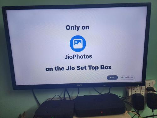 a computer monitor sitting on top of a desk at Homlee-Best Value-1BHK-Dilshad Metro-Kitchen in New Delhi