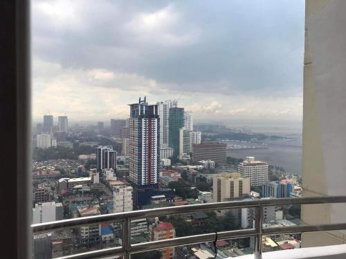 a view of a city from a building at Birch tower by matthqueenroom, malate in Manila