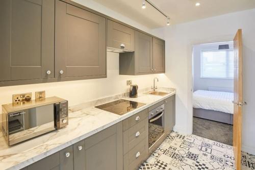 Kuchyň nebo kuchyňský kout v ubytování Apt 1 - Queens Court