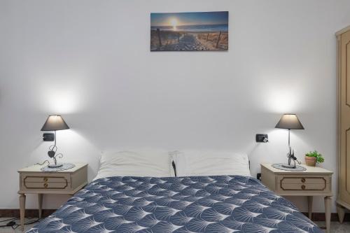 A bed or beds in a room at Casa Stella Malpensa