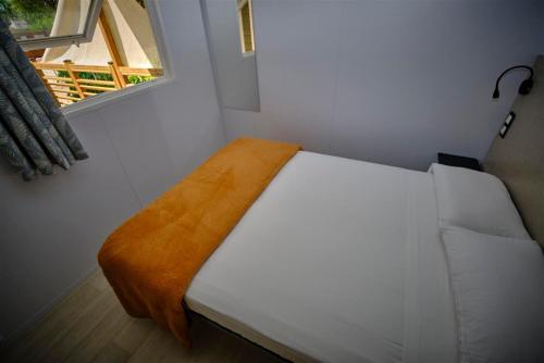 Ένα ή περισσότερα κρεβάτια σε δωμάτιο στο Camping Rodas