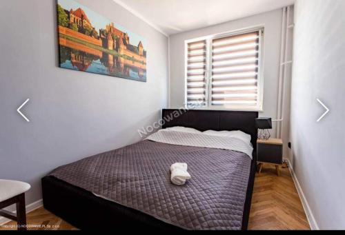 Posteľ alebo postele v izbe v ubytovaní Apartament u Kasi z widokiem na Zamek Malborski