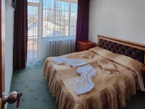 Postel nebo postele na pokoji v ubytování Guest Rooms Grachenovi