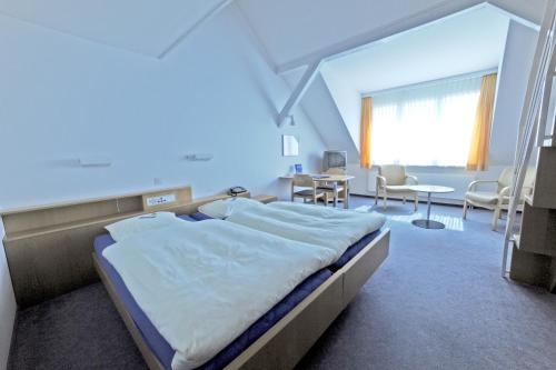 Postel nebo postele na pokoji v ubytování Hotel Ländli