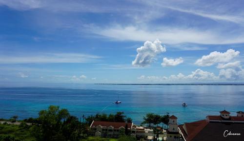 a view of the ocean with boats in the water at La Mirada Deluxe Suites with Oceanview in Mactan