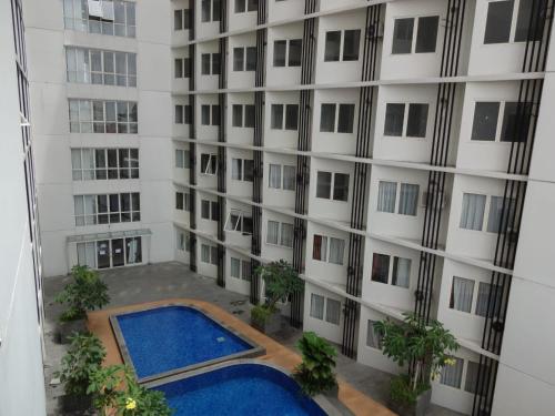 an external view of a building with a swimming pool at PADINA SUITES in Poris
