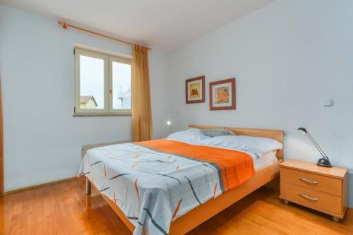 a bedroom with a bed and a window at Cencherle in Novigrad Istria