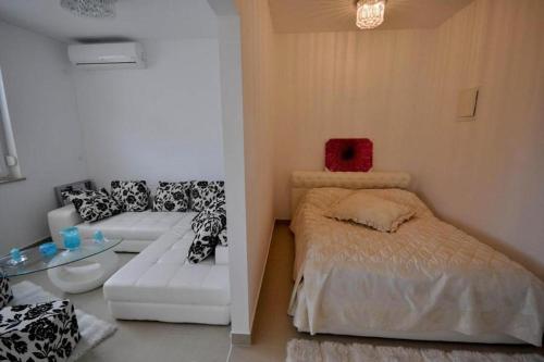 Ένα ή περισσότερα κρεβάτια σε δωμάτιο στο Holiday Home M