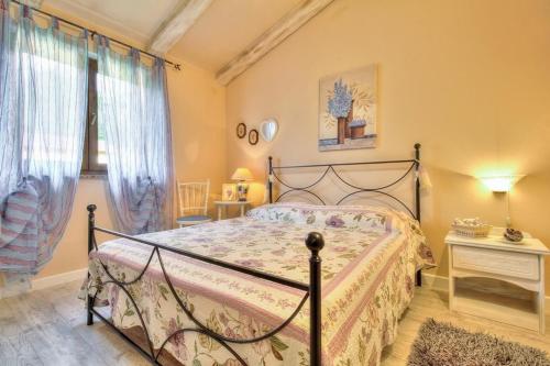 a bedroom with a bed in a room with curtains at Villa Moira in Tar