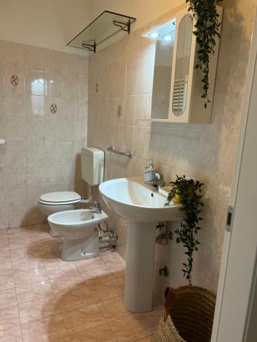 a bathroom with a sink and a toilet at Apartment Nicole in Menaggio