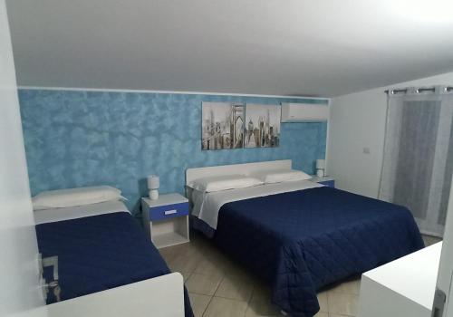 Postel nebo postele na pokoji v ubytování CASA VIA ALVARO