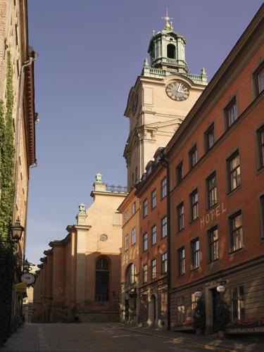 a building with a clock tower on top of it at Lady Hamilton Hotel in Stockholm