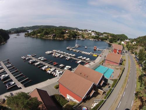an aerial view of a marina with boats in the water at Tregde Ferie in Mandal