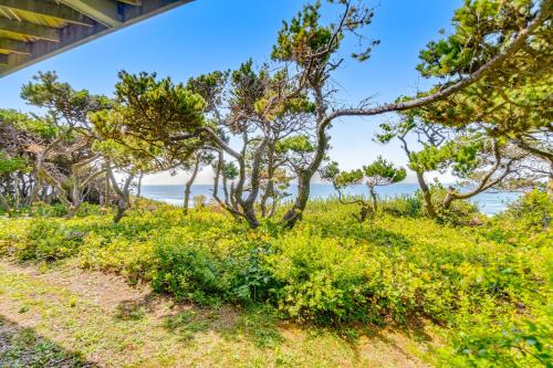 a path to the beach with trees and the ocean in the background at ShellSeeker in South Beach
