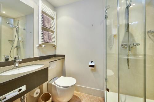Ванная комната в Zum Turm - Apartments und Gästezimmer