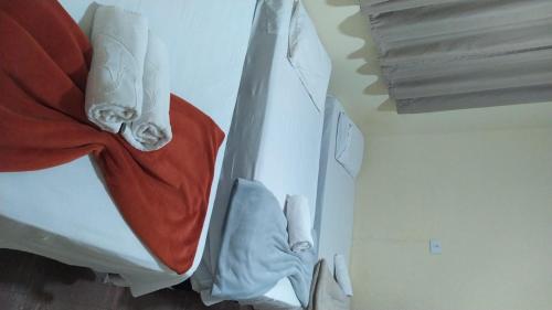 Cama o camas de una habitación en Pousada Hospede Olimpia