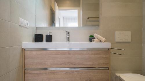 a bathroom with a sink and a mirror at La Matamar in Villacosta