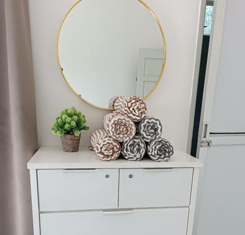 a mirror on top of a dresser in a room at Aila Homestay Pendang in Pendang