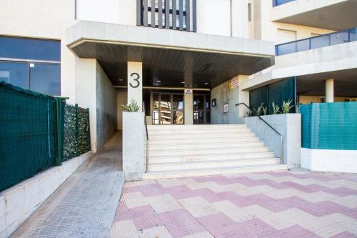 a building with the number on it at ESPACIO 5 - Primera Línea de Playa in Cullera
