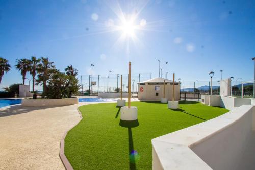 a grassy area with a skate park with a pool at ESPACIO 5 - Primera Línea de Playa in Cullera