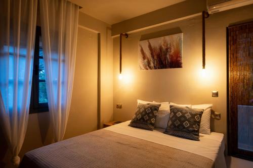 Ένα ή περισσότερα κρεβάτια σε δωμάτιο στο Di Matala deluxe apartment