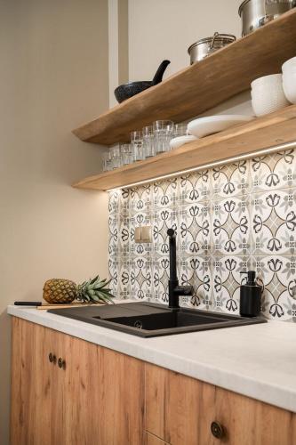 Η κουζίνα ή μικρή κουζίνα στο Di Matala deluxe apartment