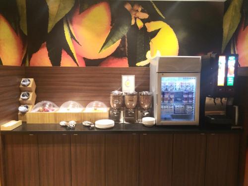 a counter with a drink machine in a room at Fairfield Inn & Suites by Marriott Poplar Bluff in Poplar Bluff