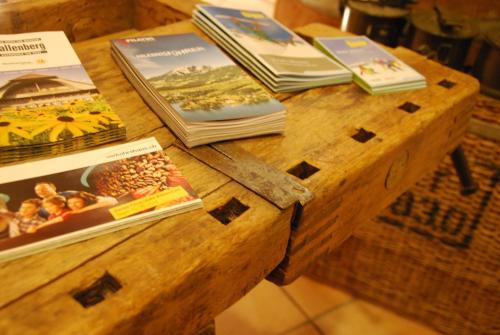 a wooden table with books on top of it at Landgasthof Schlüssel Alpnach in Alpnach