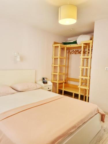 a small room with two beds and a shelf at Portalimo Lodge Hotel - Adult Only +12 in Cıralı