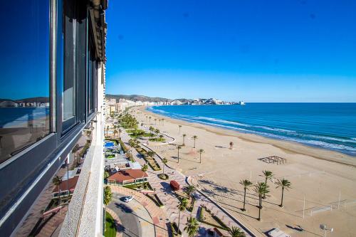 a view of a beach and the ocean from a building at 13 ESPACIO SOBRE MAR in Cullera