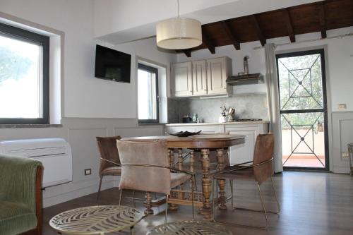 a kitchen with a table and chairs in a room at Agriturismo Castello Santa Margherita in Cori