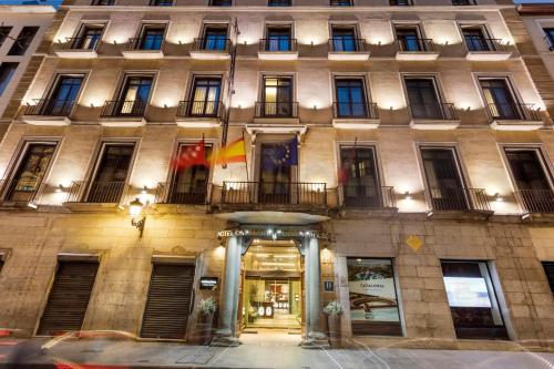 a facade of a building with a flag at Catalonia Puerta del Sol in Madrid