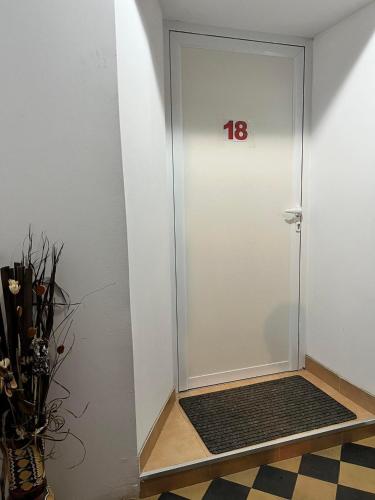 a white door with a number on it at Wohnung 18 in Lutherstadt Eisleben