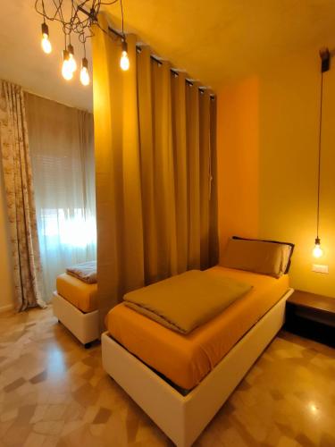 a bedroom with two beds and a window at Zeljko's luxury hostel in Vicenza