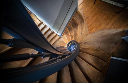 an overhead view of a spiral staircase in a building at Bienvenue Chez Nous in Bergues