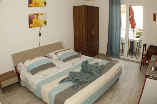 Postel nebo postele na pokoji v ubytování A1 tončev apartman