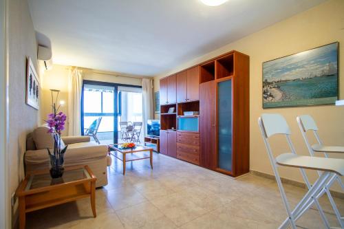 a living room with a couch and a table at ESPACIO 16 - Primera LINEA PLAYA in Cullera