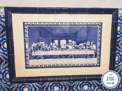 a painting of a group of people in a room at Casa do Vereador in Ponta Delgada