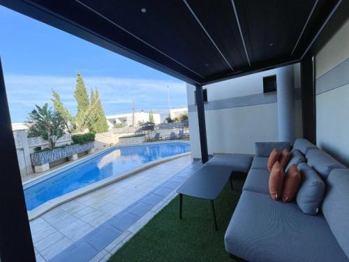 a view of a swimming pool from the balcony of a house at DREAM VILLA IN ALBIR BLUELINE in L'Alfas del Pi