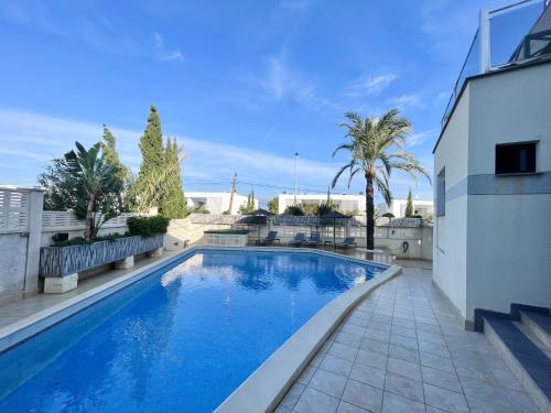 a swimming pool in the backyard of a house at DREAM VILLA IN ALBIR BLUELINE in L'Alfas del Pi