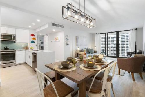 a kitchen and dining room with a table and chairs at Sst3 #1209 in Marco Island