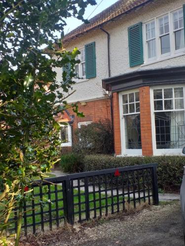 a black fence in front of a house at JESMOND House B&B room 1 in Hull