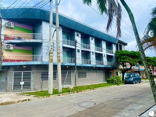 a building with balconies on the side of it at Selva Suites in Iquitos