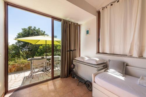 Ένα ή περισσότερα κρεβάτια σε δωμάτιο στο Domus Moon Apartment with sea view Villasimius